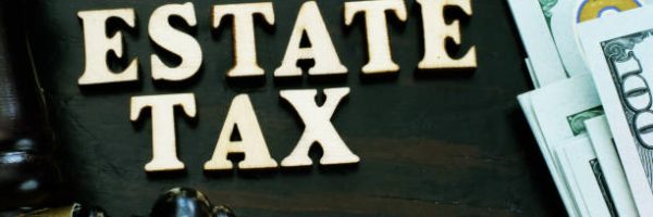 Estate tax from wooden letters and gavel.