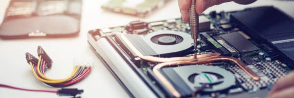 technician repairing laptop computer closeup