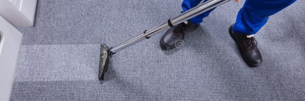 janitor-cleaning-carpet-s-hand-vacuum-cleaner-126282708